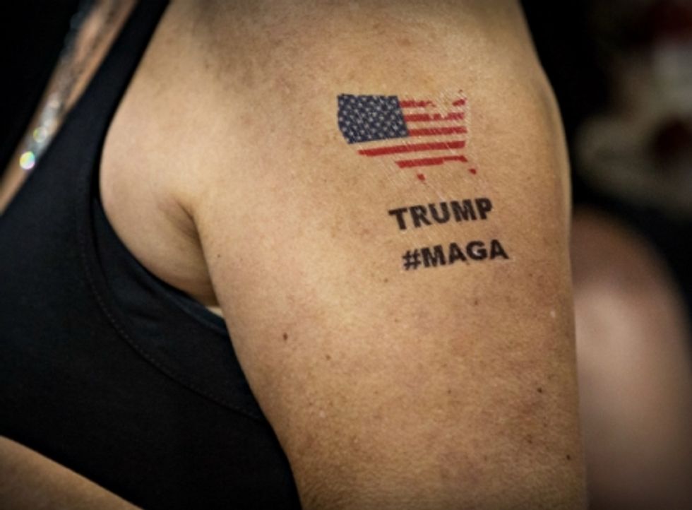 Photo of a Trump supporter's tattooed arm reading "TRUMP #MAGA" with a map of the USA, in Tampa, Florida