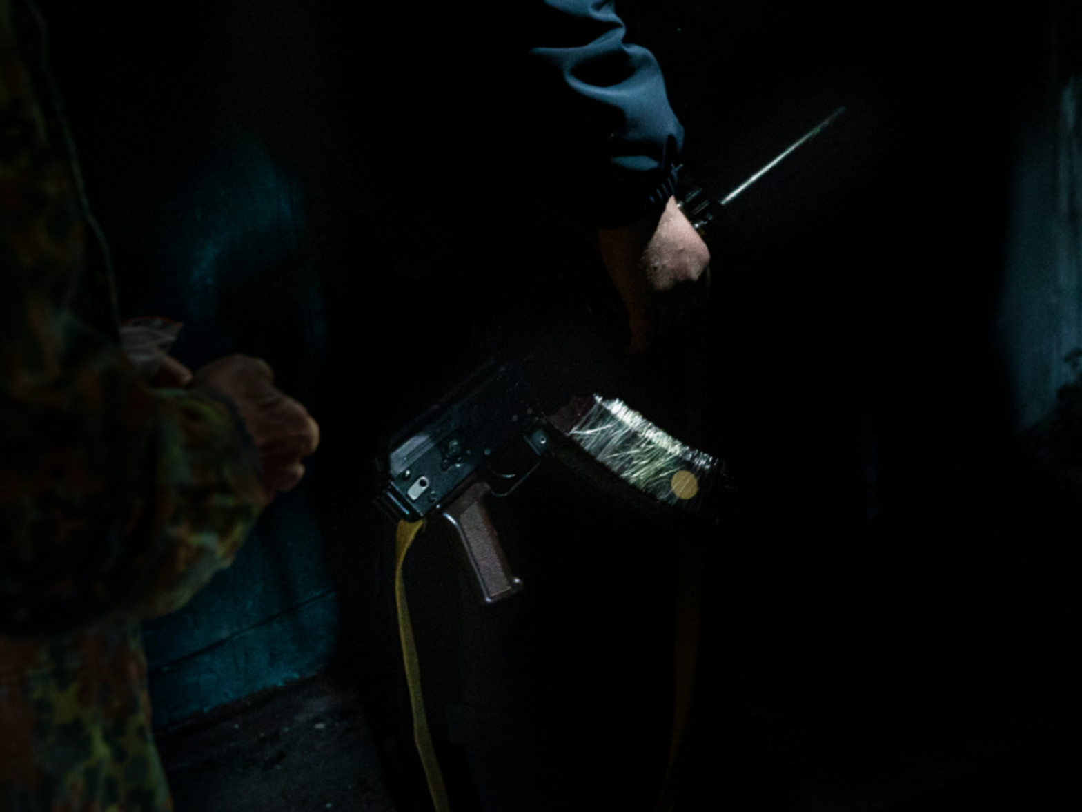 Photo of a Ukrainian soldier holding a rifle in an apartment building in Kharkiv, Ukraine