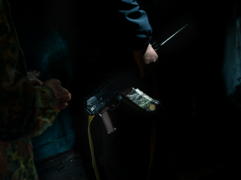 Photo of a Ukrainian soldier holding a rifle in an apartment building in Kharkiv, Ukraine
