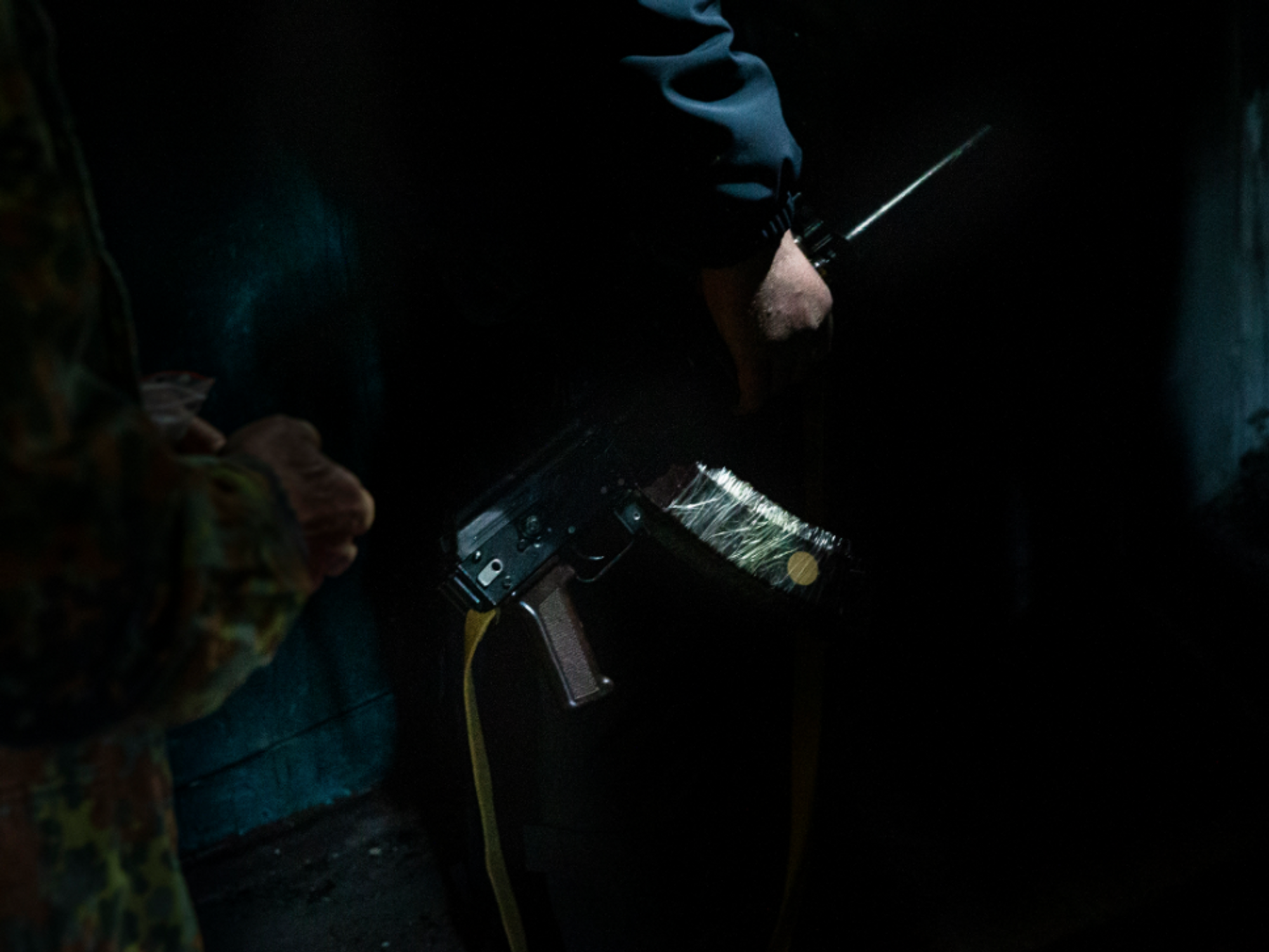 Photo of a Ukrainian soldier holding a rifle in an apartment building in Kharkiv, Ukraine