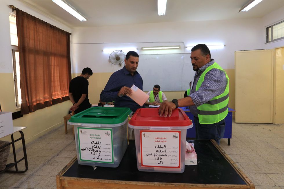 Photo of a voter casting his ballot at a polling station in Amman, Jordan on Sept. 10.