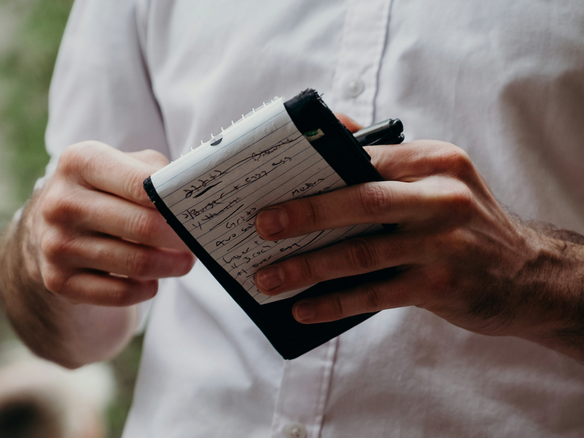 photo of a waiter and his notebook