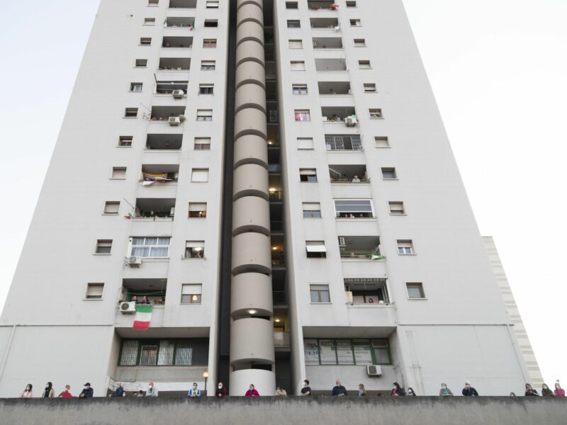 photo of a white high-rise apartment building