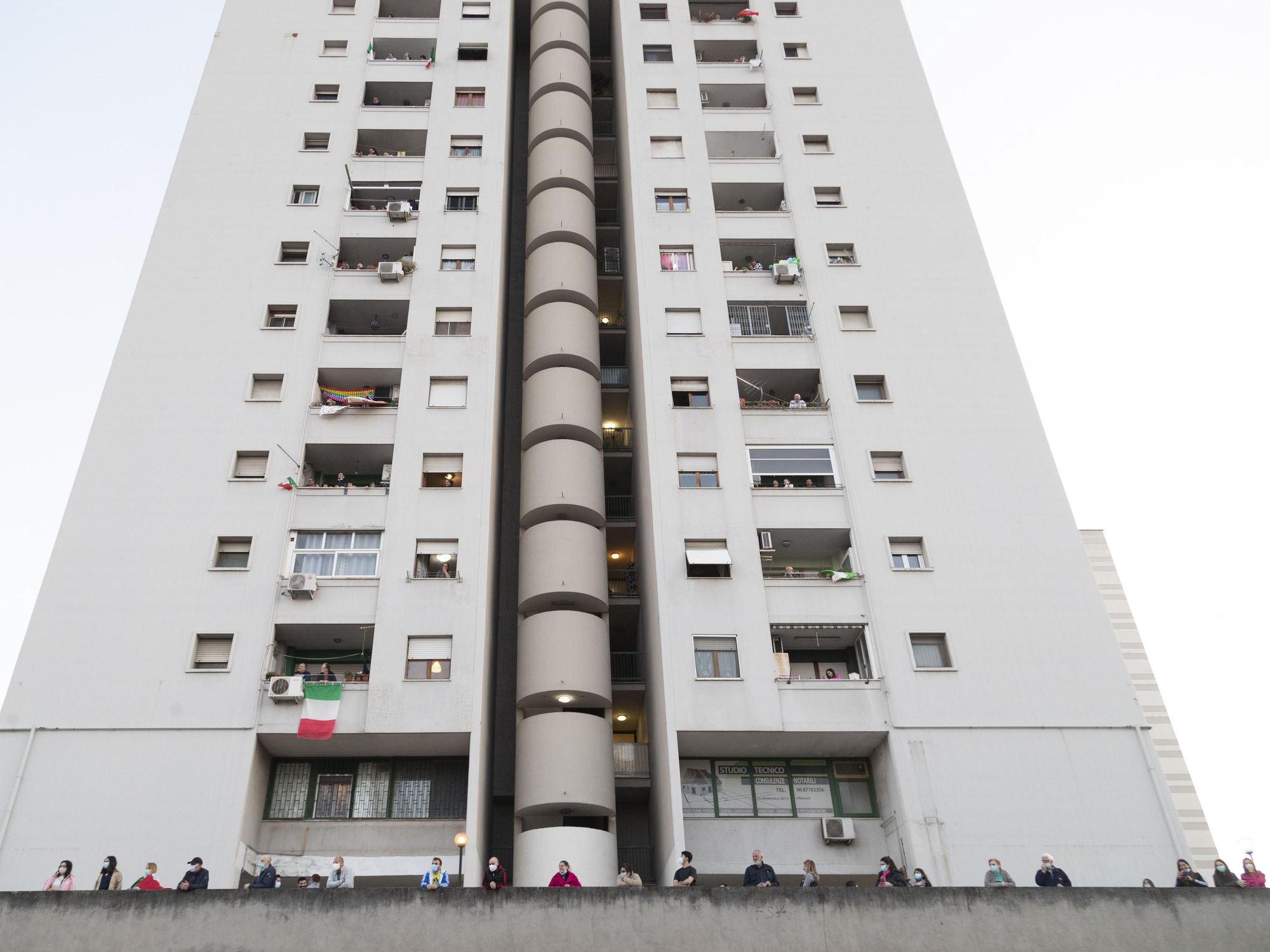 photo of a white high-rise apartment building