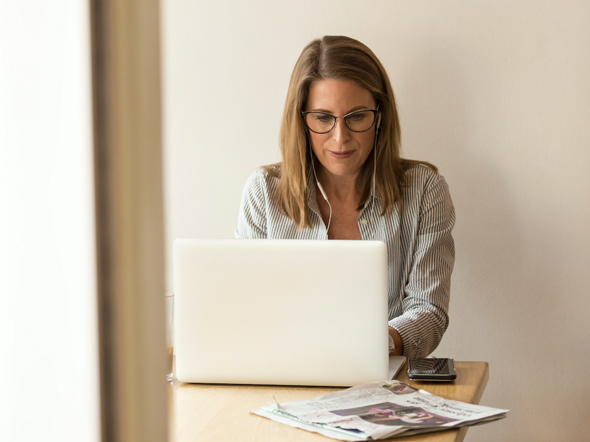 Photo of a woman behind a computer in an office