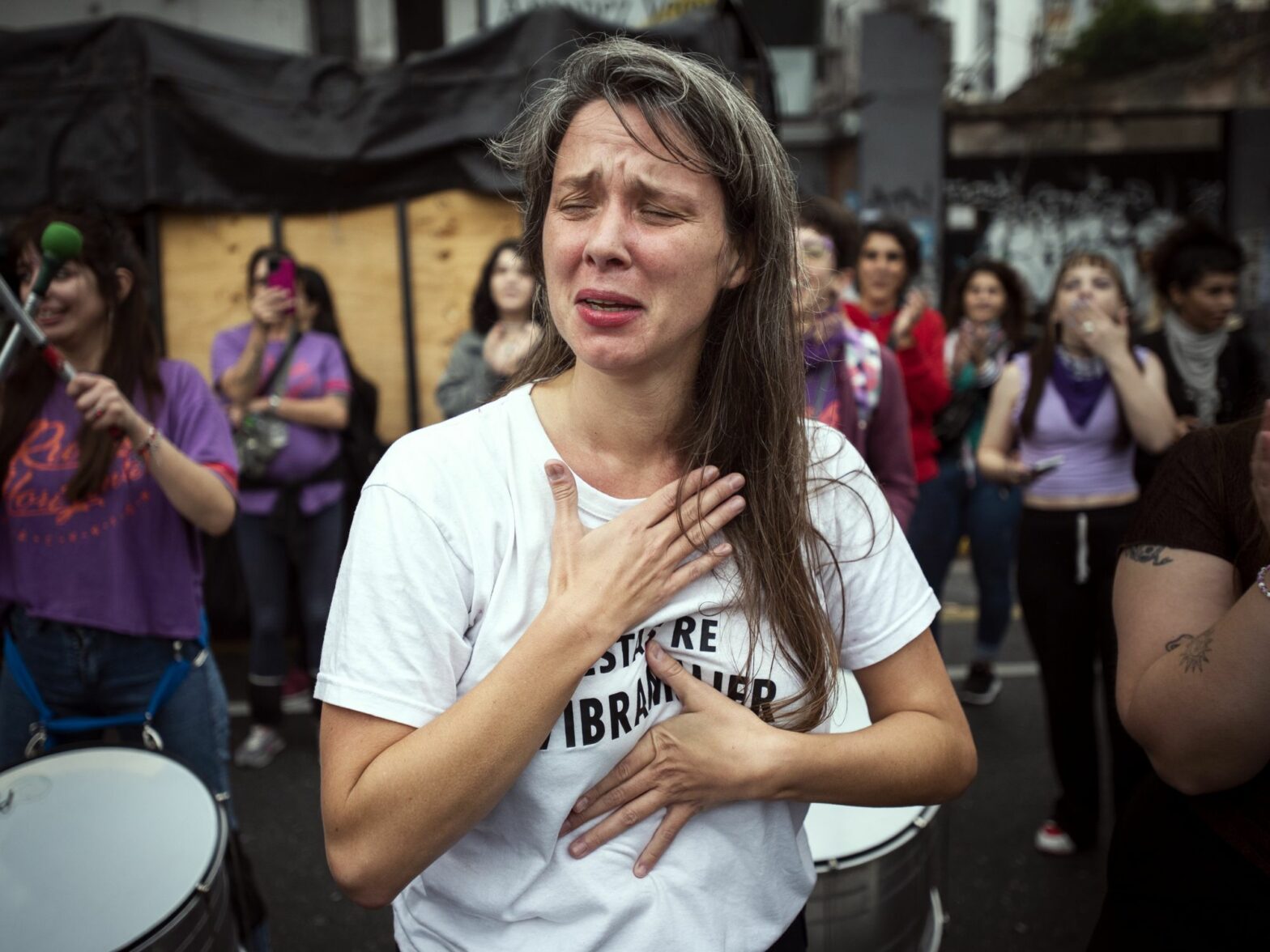 photo of a woman crying at a protest