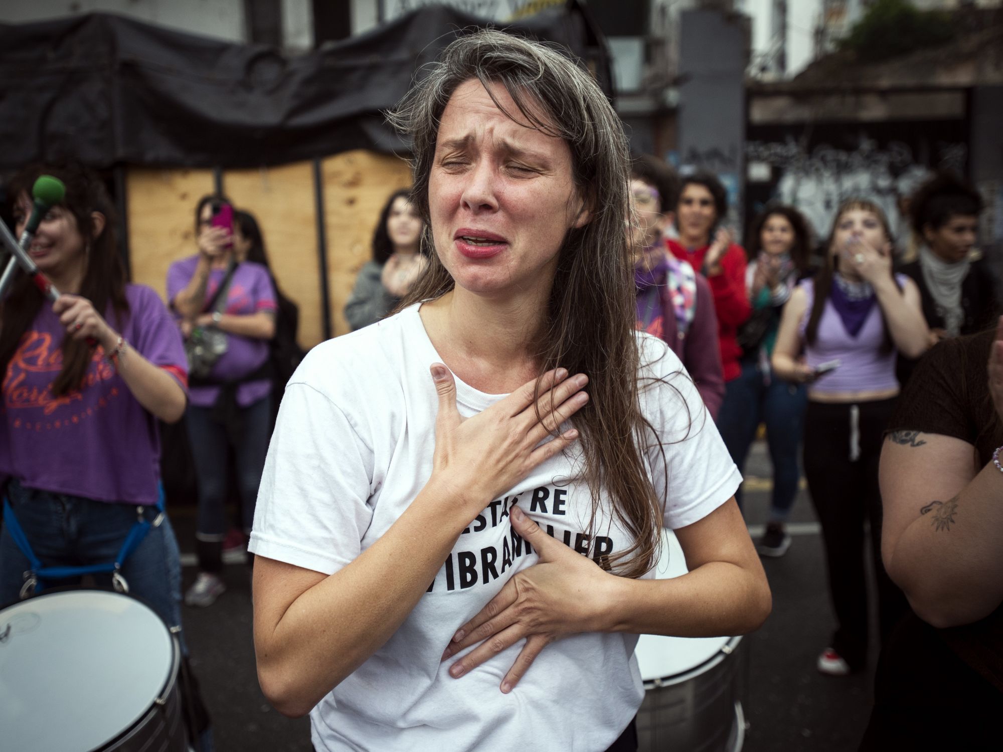 photo of a woman crying at a protest