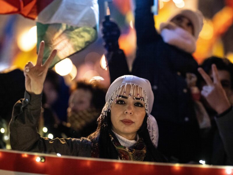 Photo of a woman demonstrating during a rally in solidarity with Syrian Kurds in Hesse, Germany, on Dec. 14