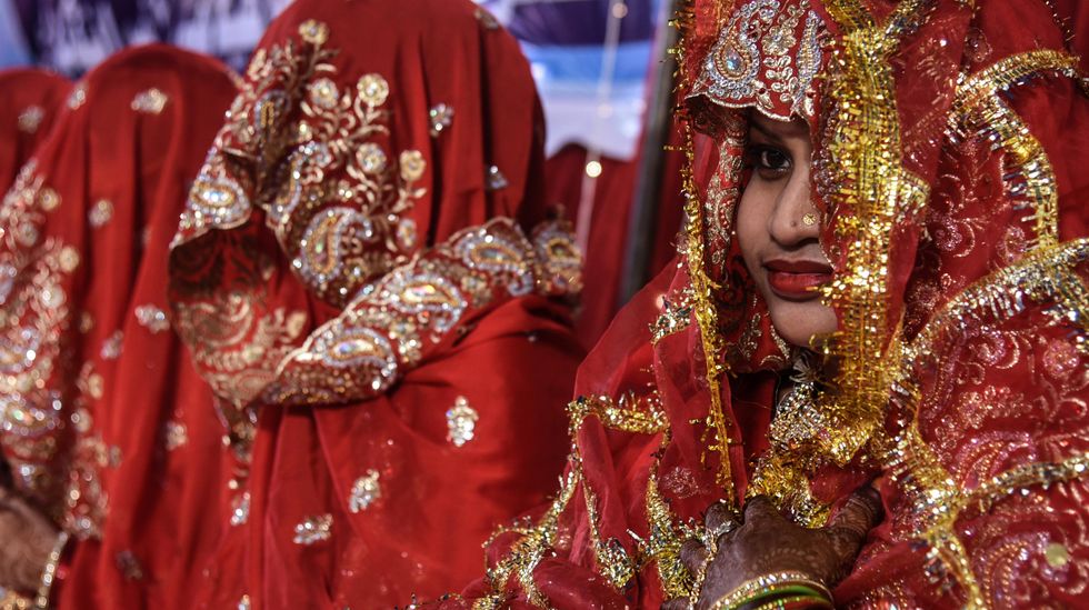 photo of a woman in a traditional red wedding robe