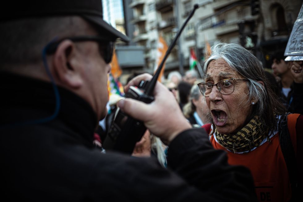 Photo of a woman in an altercation with the police at the retiree march in front of Congress in Buenos Aires, Argentina, Sept. 25, 2024.