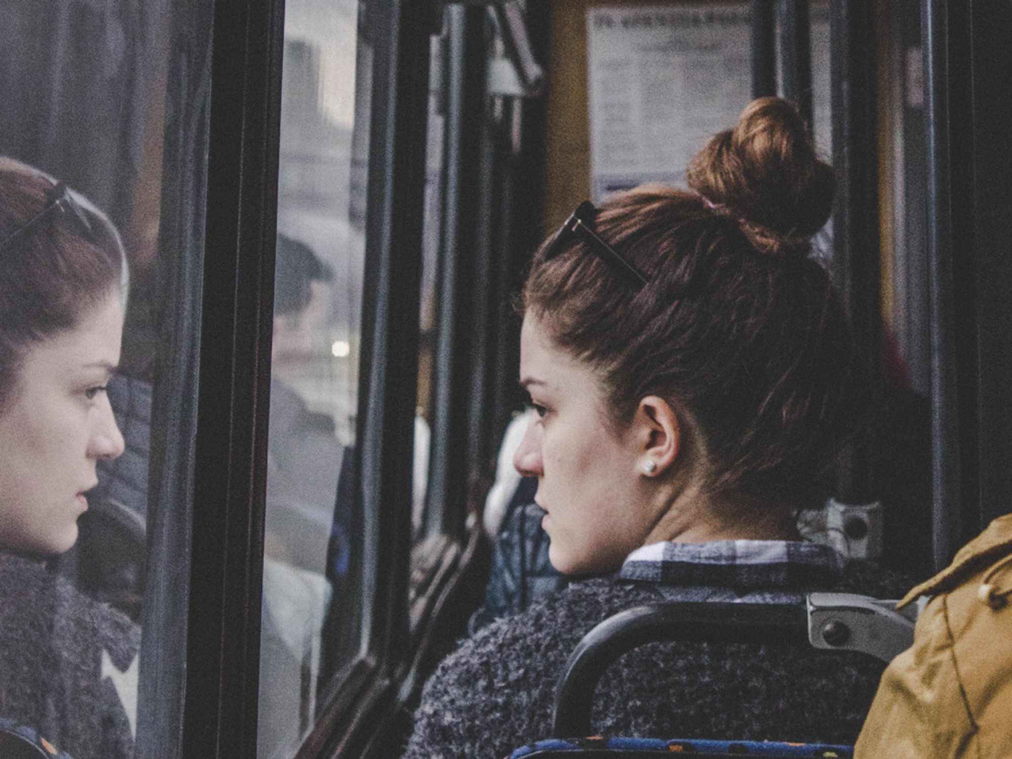 Photo of a woman looking out the window of a bus in Chisinau, Moldova