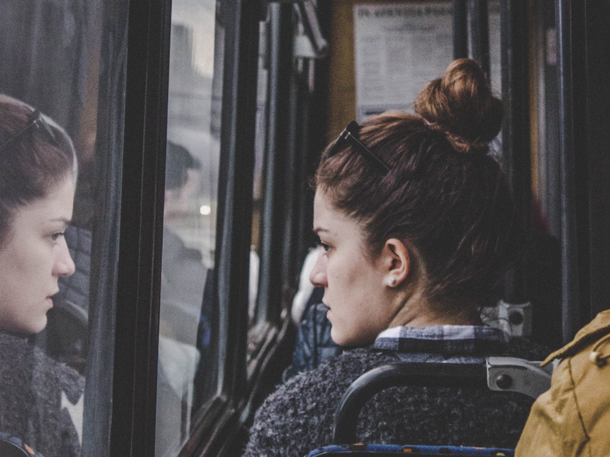 Photo of a woman looking out the window of a bus in Chisinau, Moldova