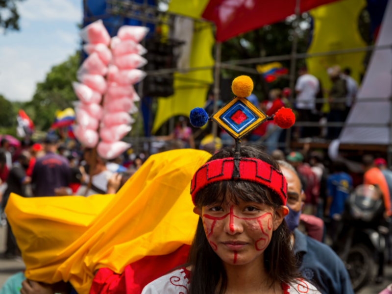 Photo of a woman participating in a march during the Day of Indigenous Resistance in Caracas, Venezuela, on October 12