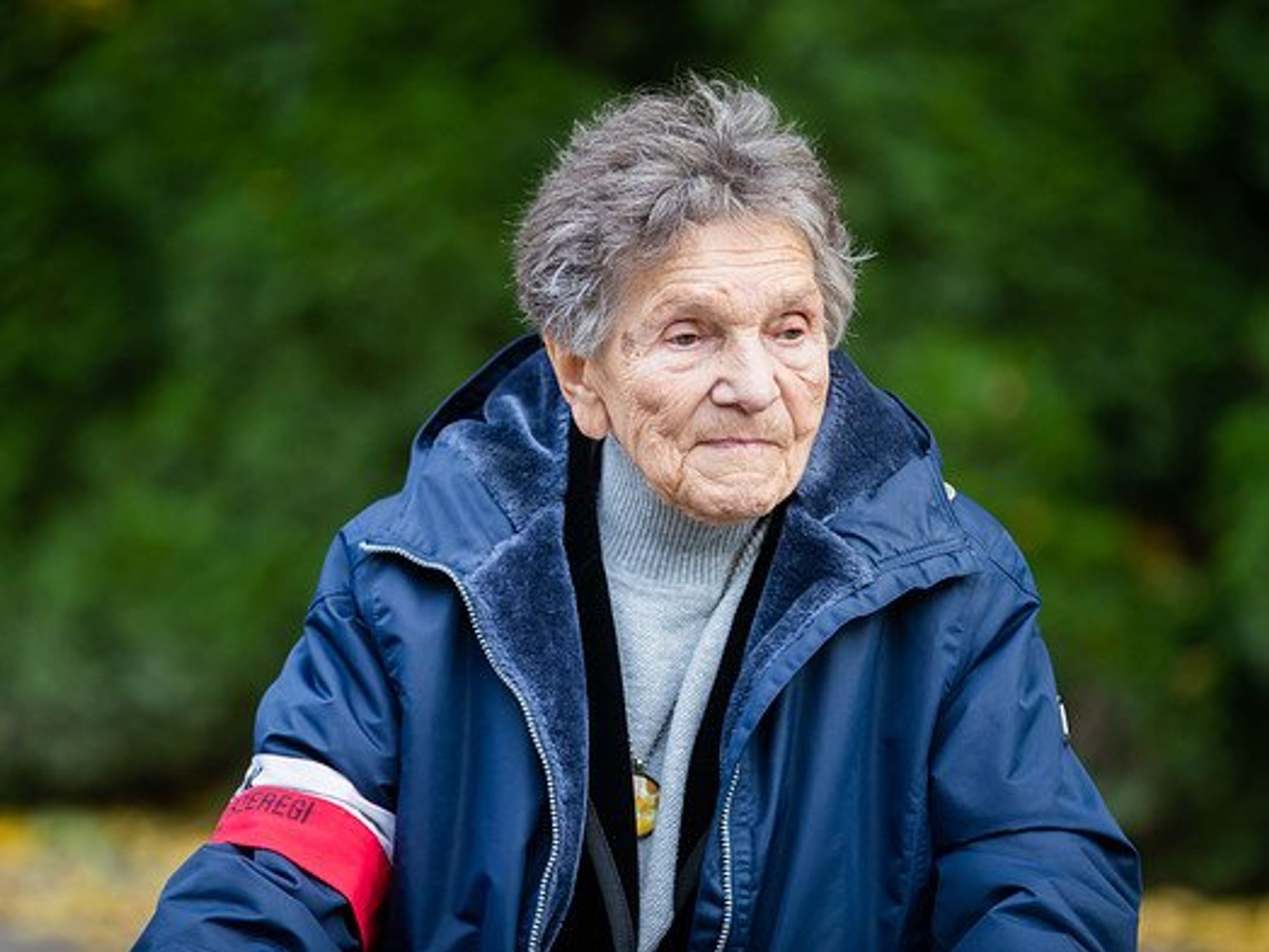 Photo of a woman standing.