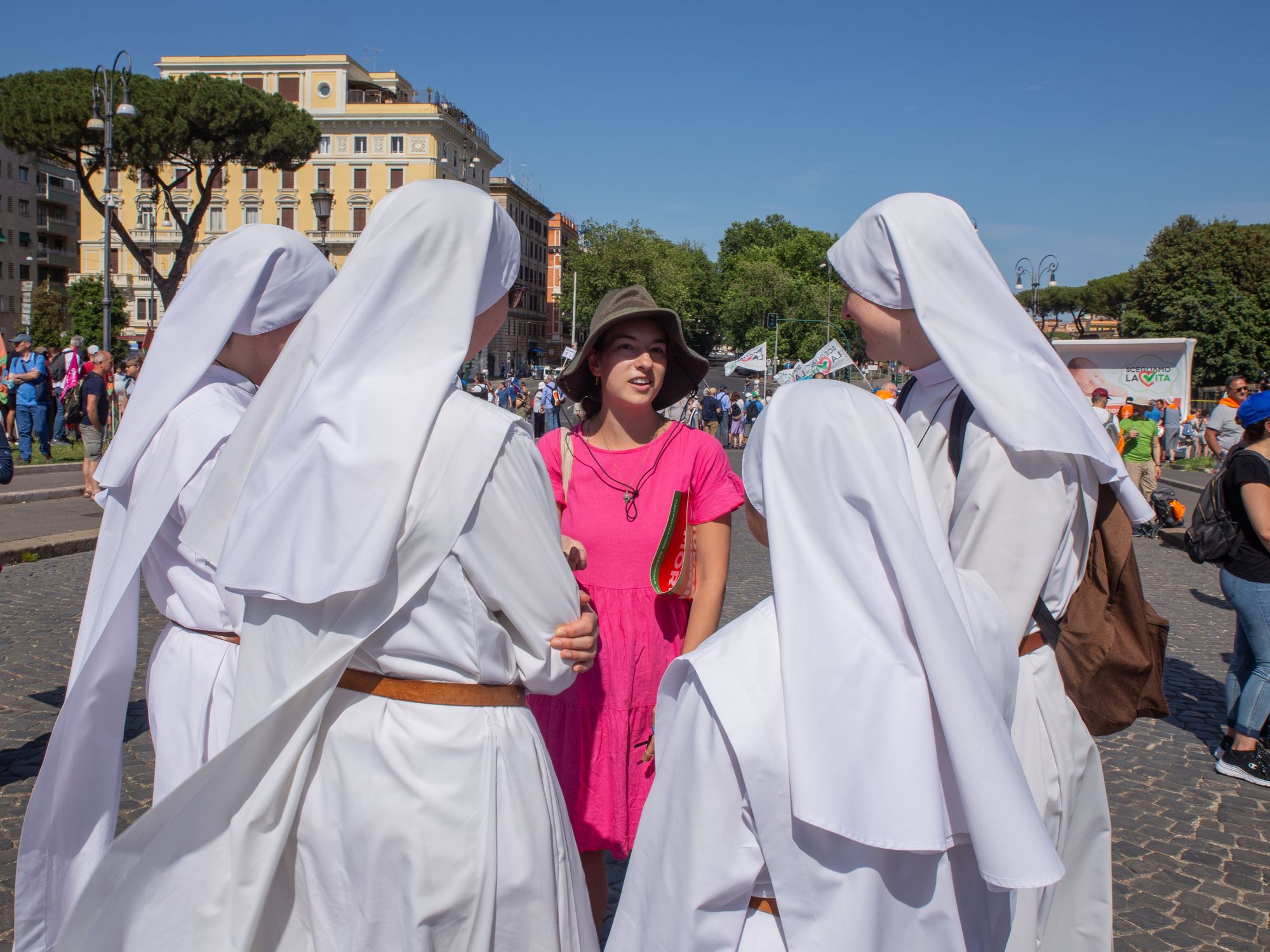 Photo of a woman surrounded by nuns during an anti-abortion demonstration in Rome, Italy