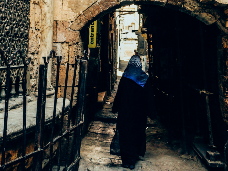 Photo of a woman walking in Cairo, Egypt.