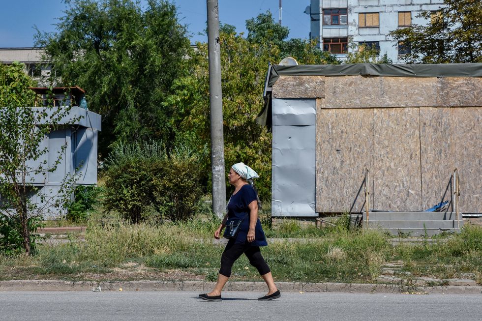 Photo of a woman walking in the streets of Zaporizhzhia, Ukraine, on Aug. 29