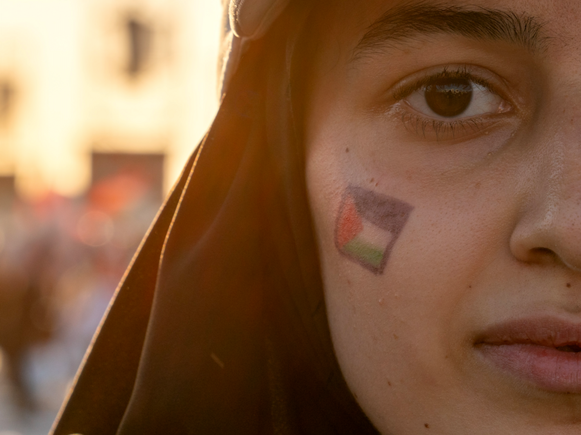Photo of a woman with a Palestinian flag painted on her face at a pro-Palestineian rally in Istanbul on Oct. 28