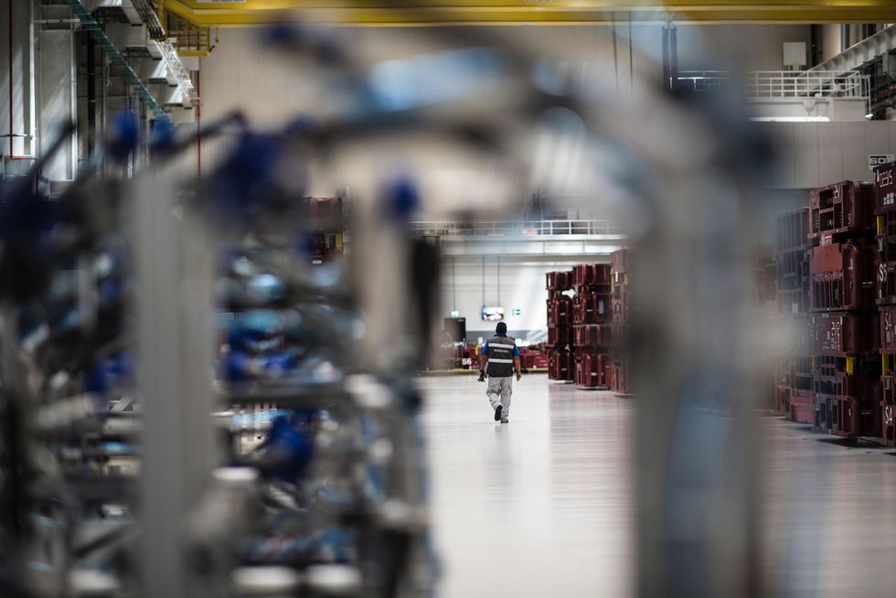 Photo of a worker at an Audi car factory in Chiapa, Mexico.