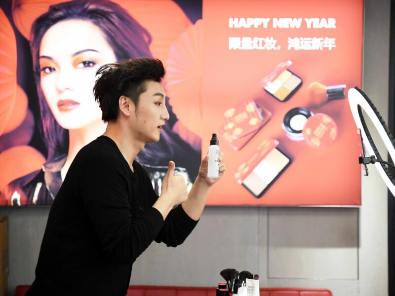 photo of a young man displaying products