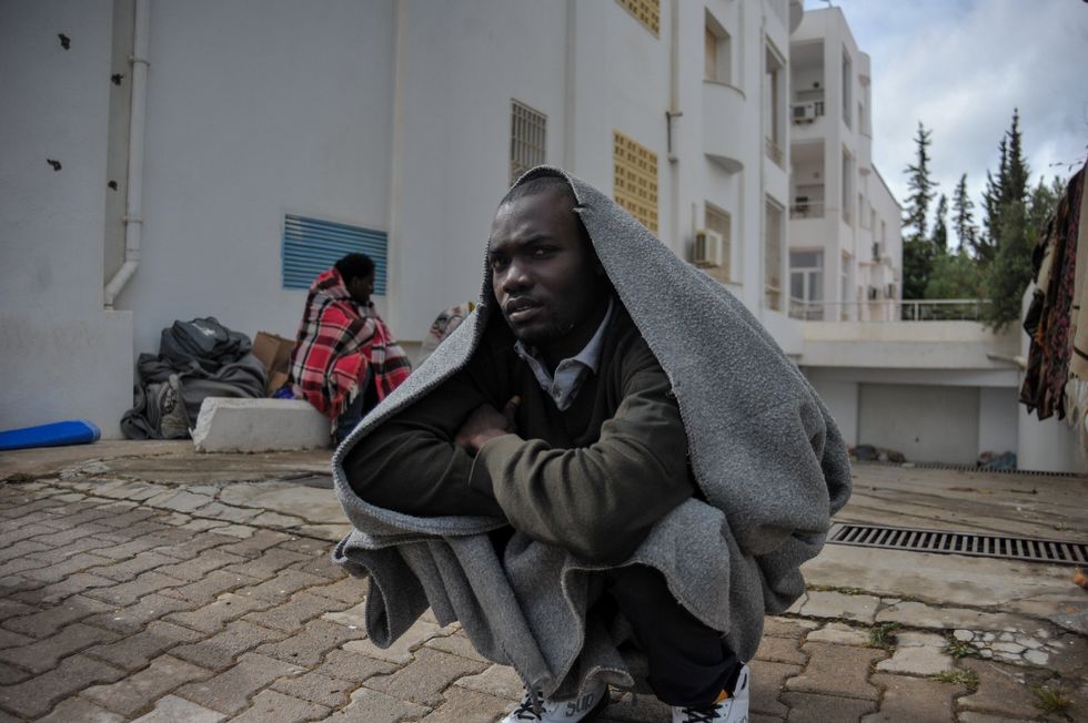 Photo of African migrant staging a sit-in in front of the UNHCR headquarter in Tunis