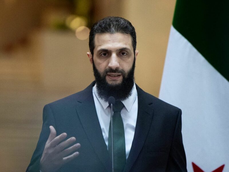 Photo of Ahmed al-Sharaa speaking at a Press Conference in Damascus