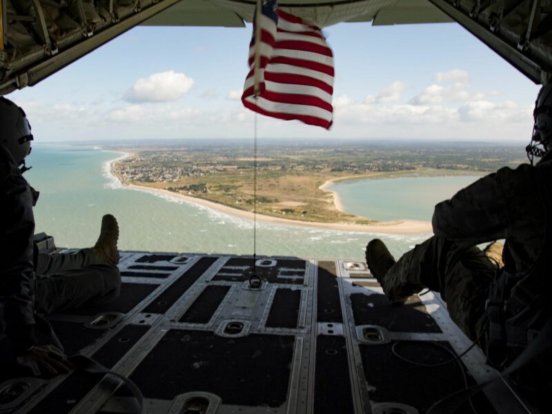 photo of american flag of beach and coastline