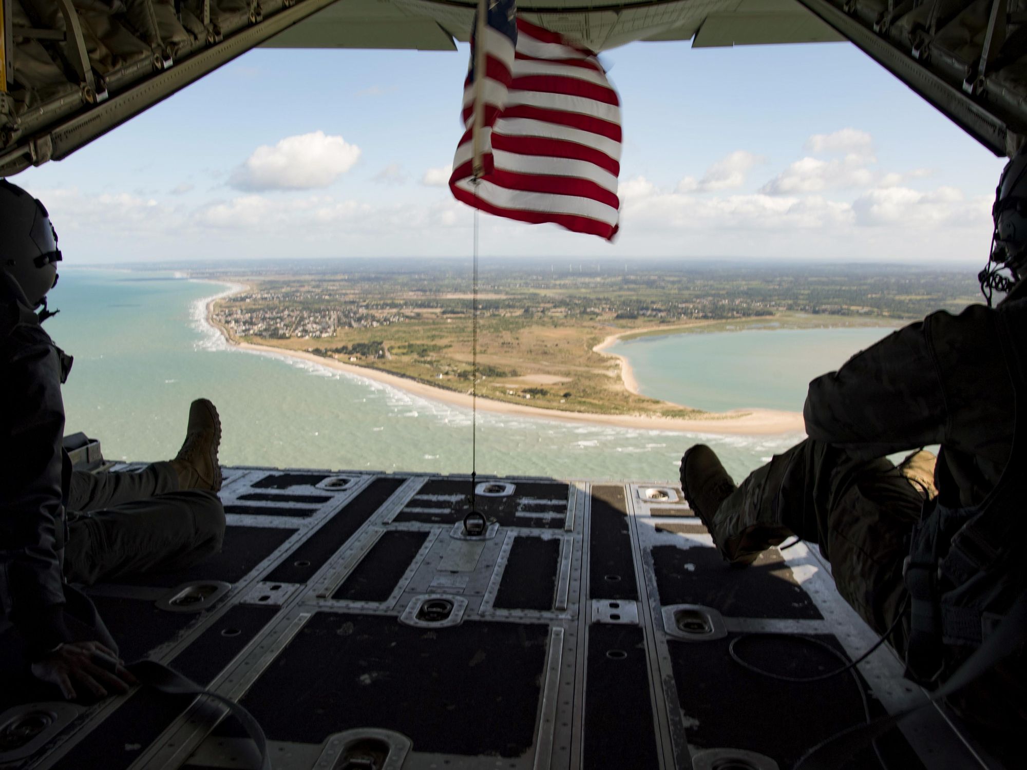 photo of american flag of beach and coastline