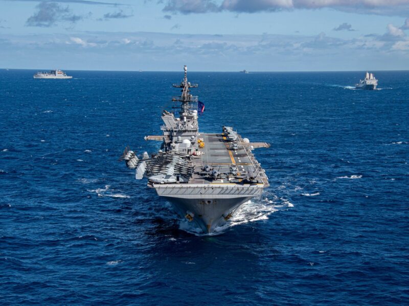photo of an aircraft carrier in blue seas