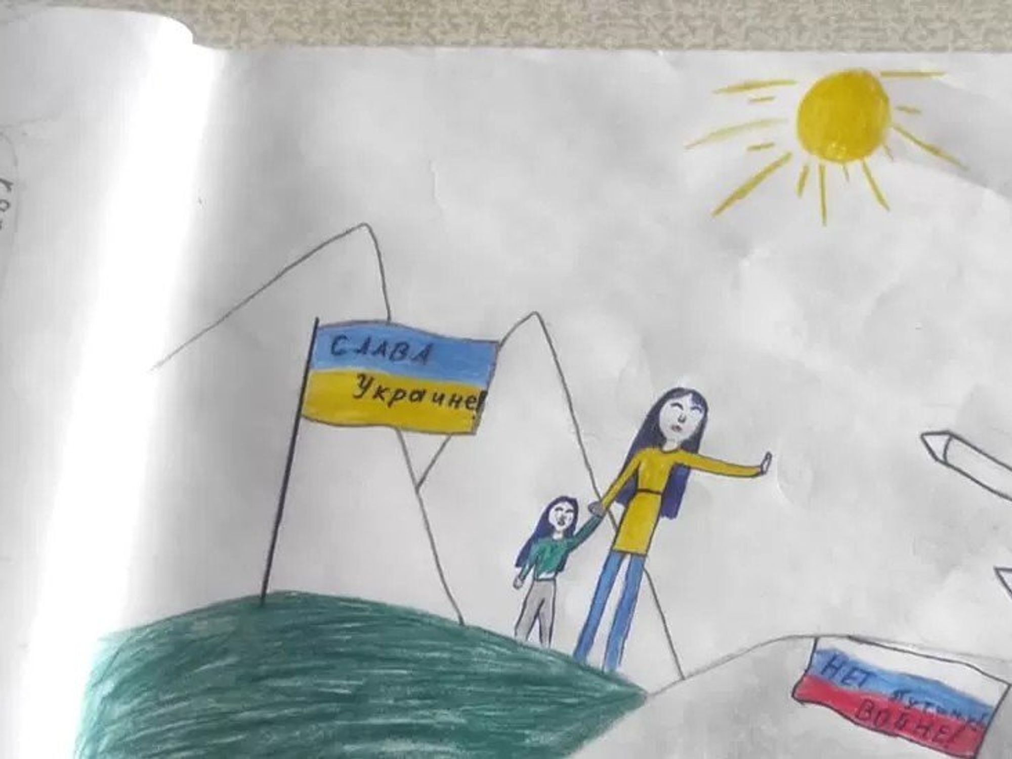 Photo of an anti-war drawing by a 13-year-old girl