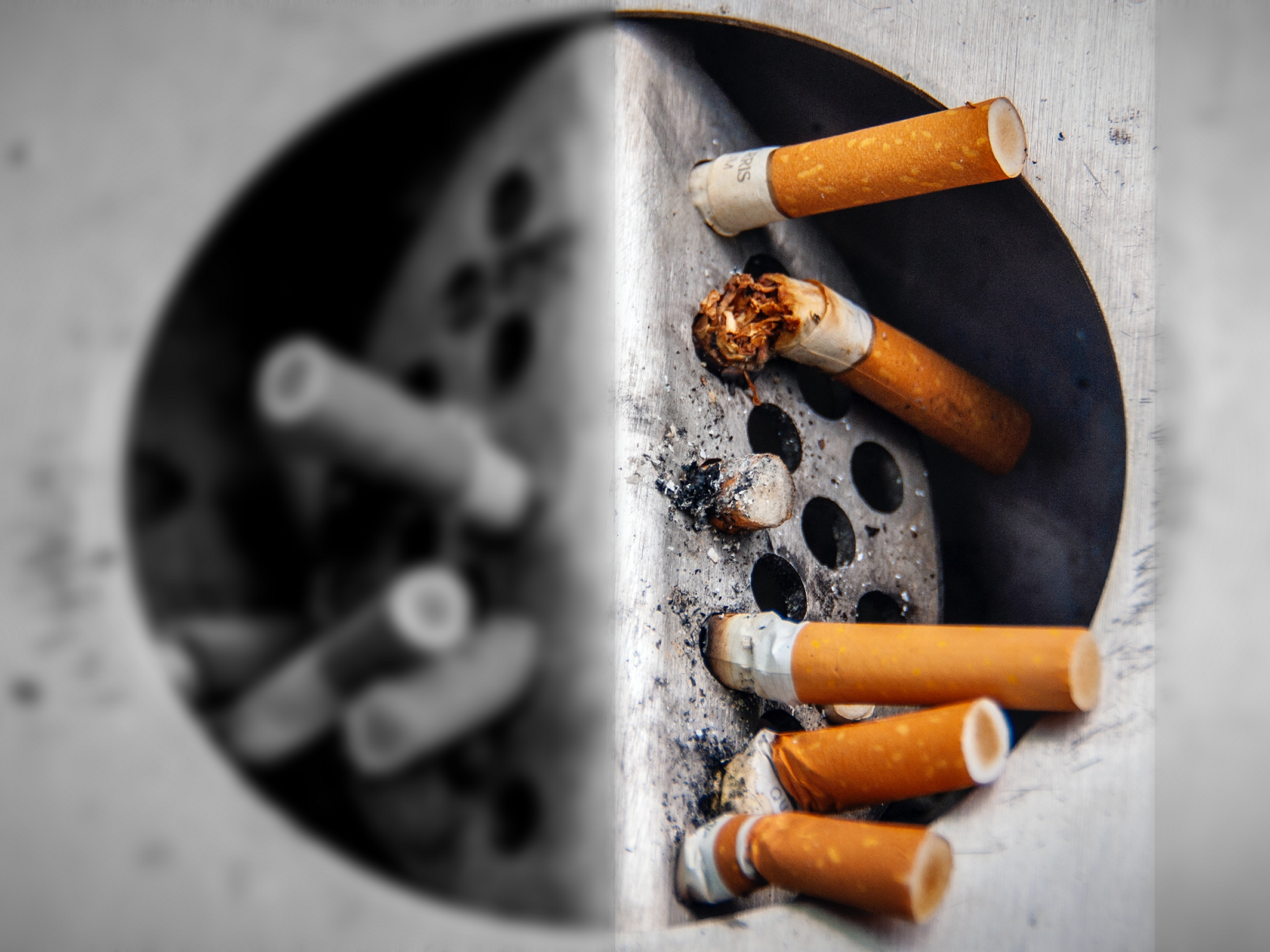 Photo of an ashtray full of cigarettes