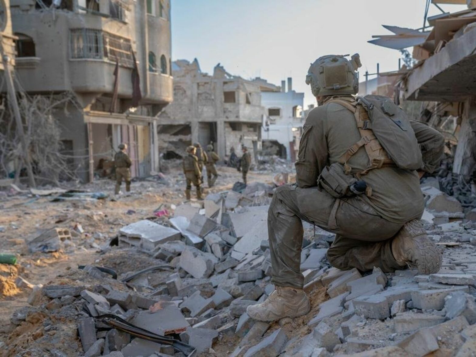 photo of an IDF soldier on a pile of concrete in gaza