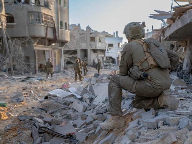 photo of an IDF soldier on a pile of concrete in gaza