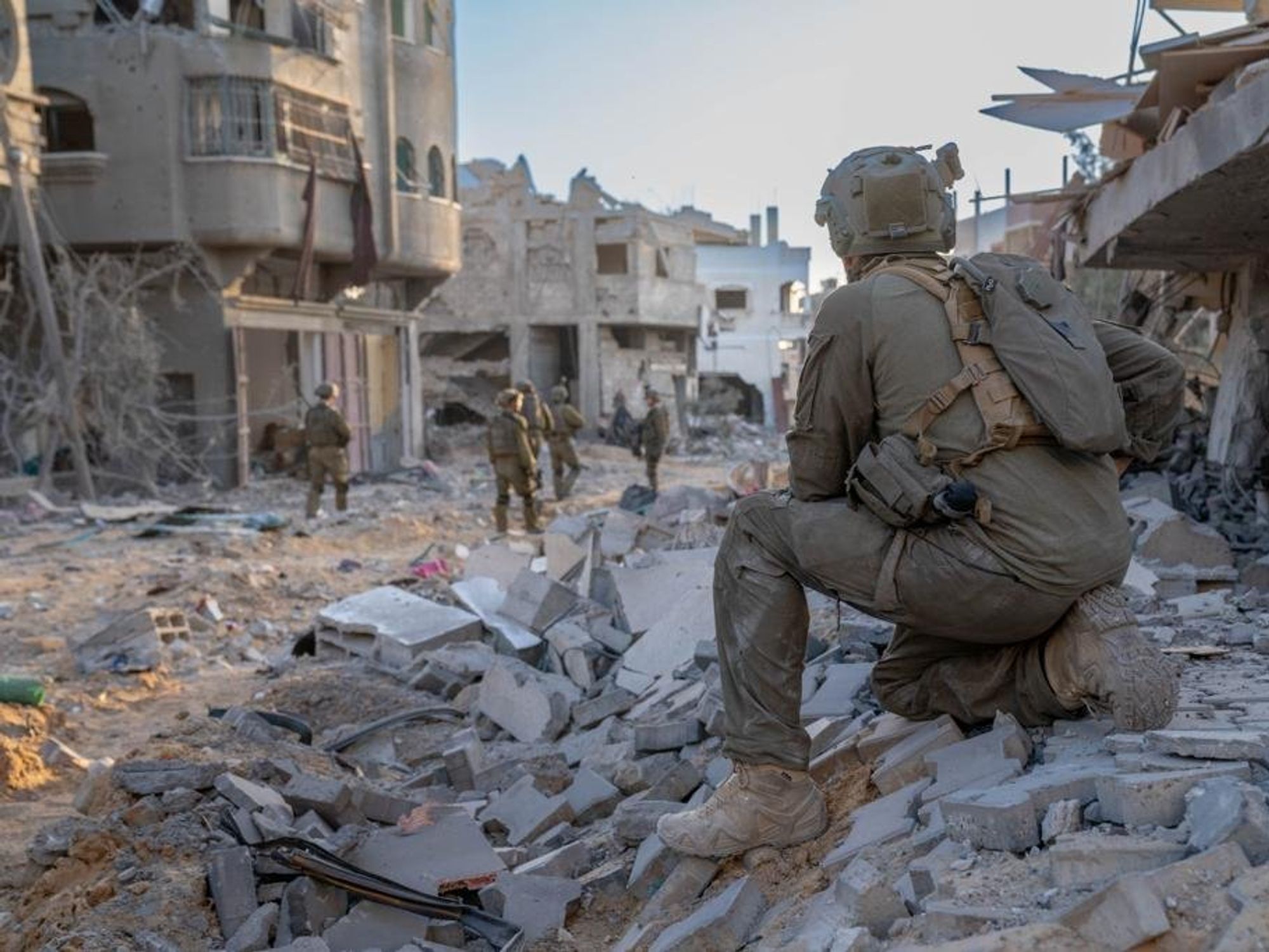 photo of an IDF soldier on a pile of concrete in gaza