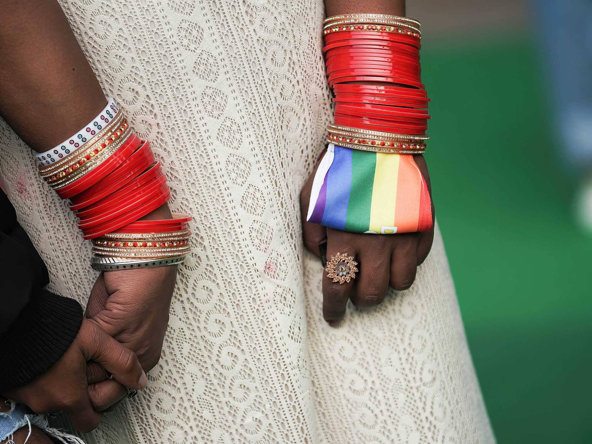 Photo of an Indian couple holding hands.