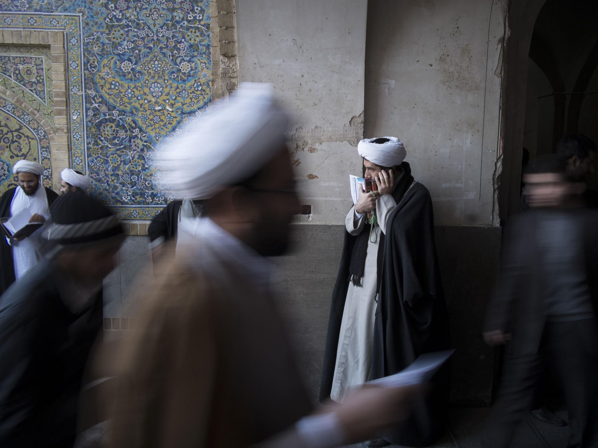 Photo of an Iranian cleric speaking on the phone in Qom, Iran