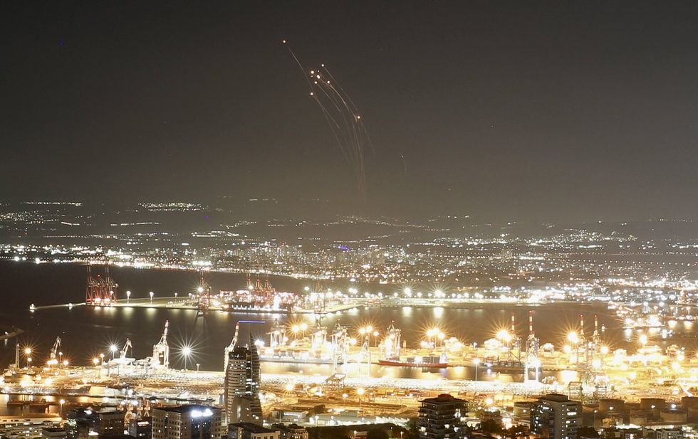Photo of an Israeli anti-missile system intercepting rockets fired from Lebanon, as seen from Haifa, in northern Israel on Sept. 24.