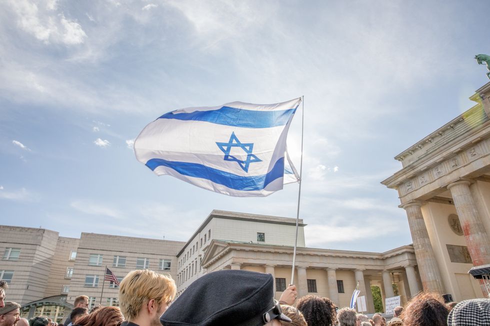 photo of an israeli flag at a rally