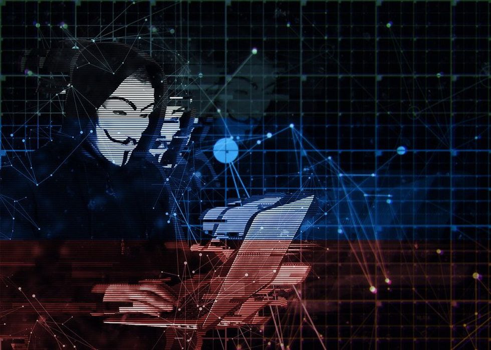 photo of anonymous hacker with russian flag overlay