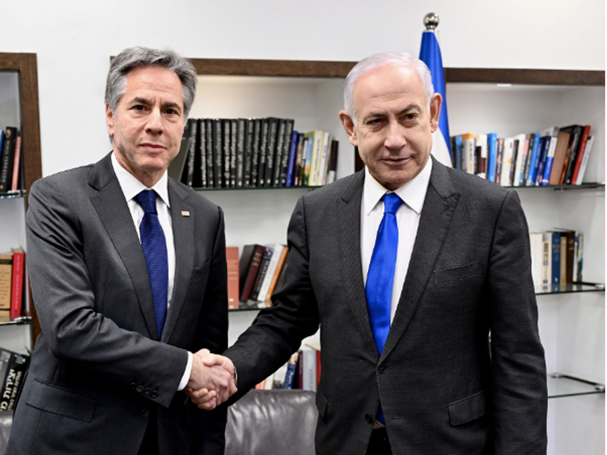 photo of Antony Blinken and Israeli Prime Minister Benjamin Netanyahu shaking hands