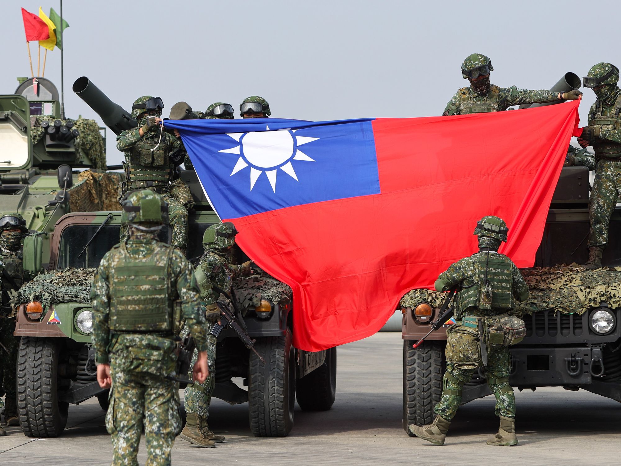 Photo of Army soldiers holding a Taiwanese flag during a military drill simulating defence operations