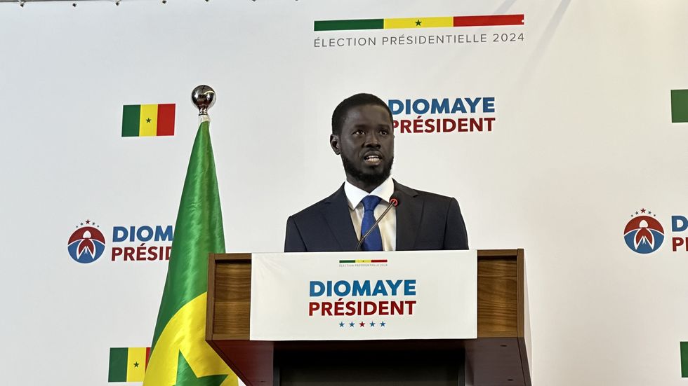 Photo of Bassirou Diomaye Faye speaking at his first post-election press conference in Senegal.