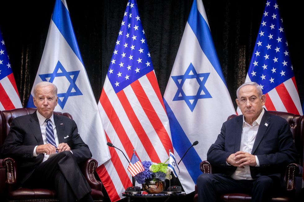 photo of Biden and Netanyahu in front of flags