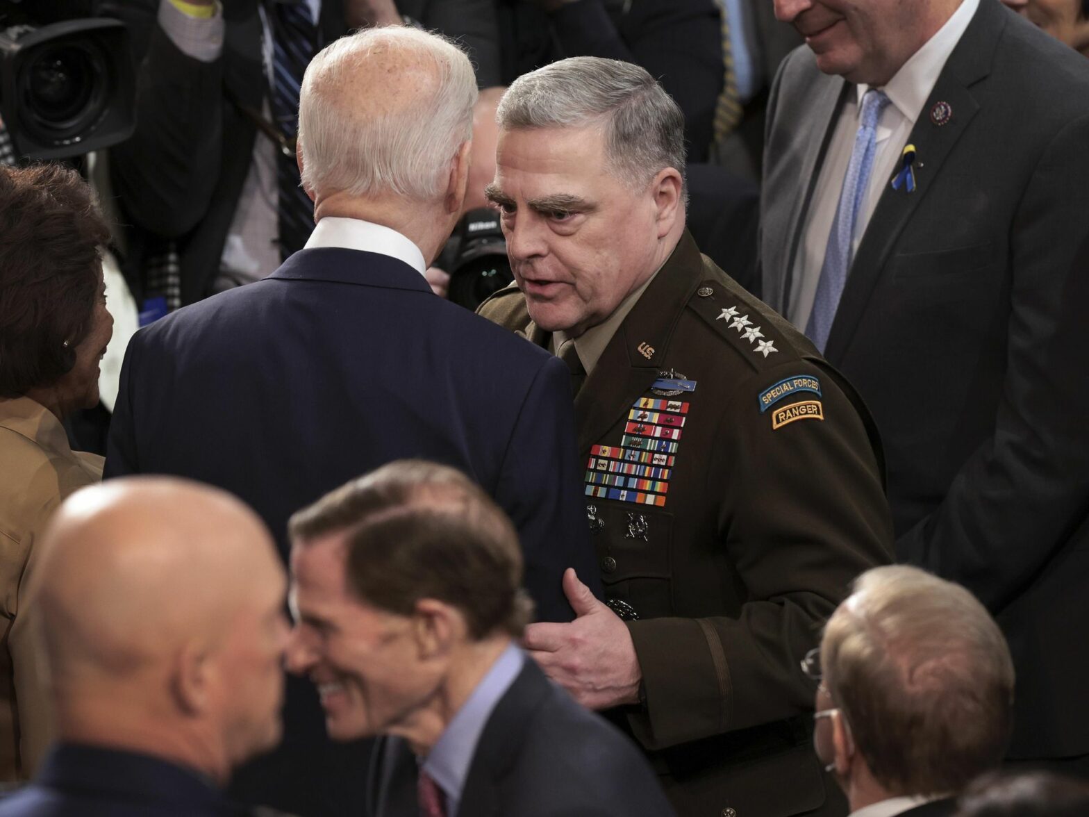 photo of biden talking to mark miley