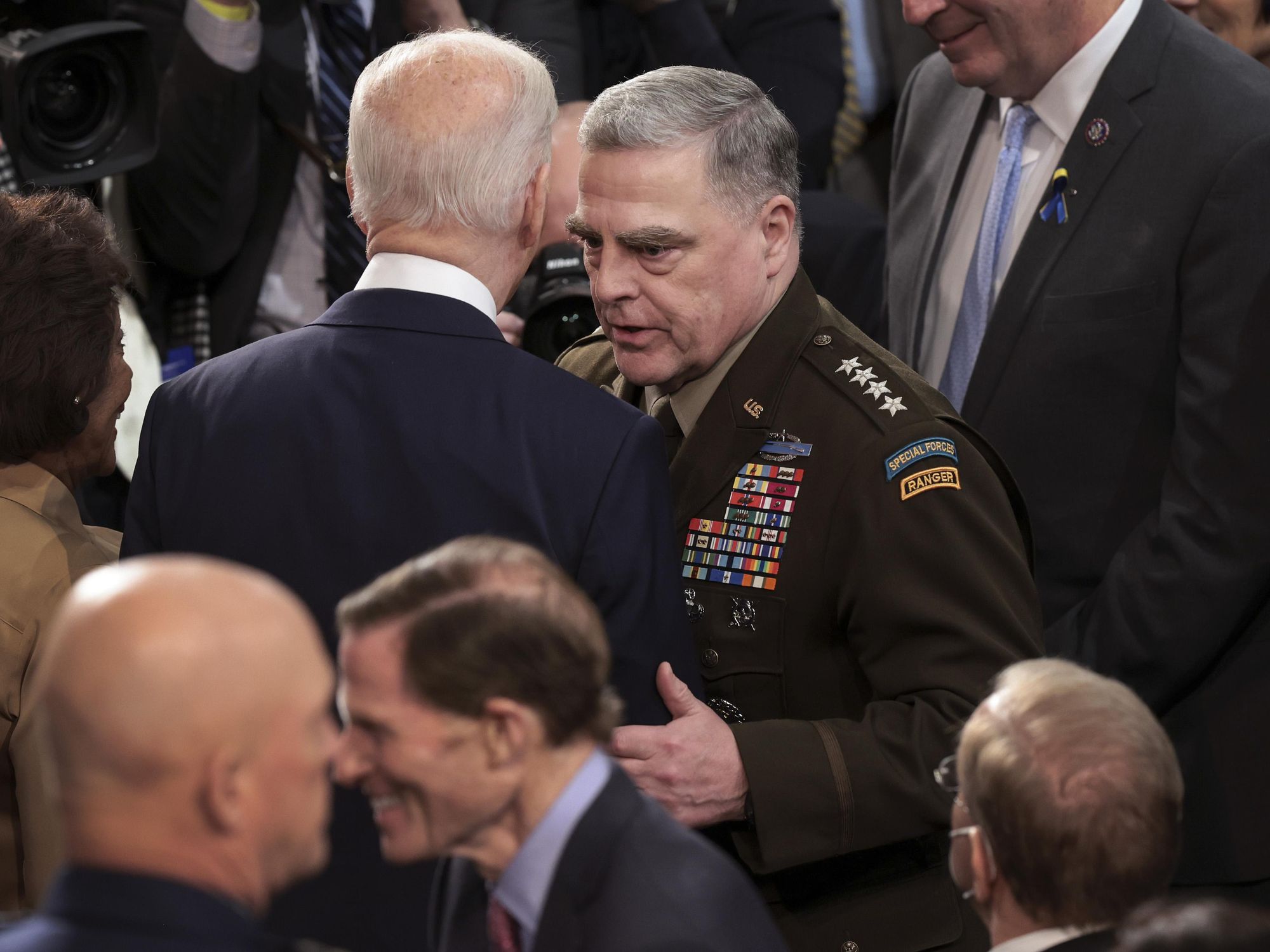 photo of biden talking to mark miley
