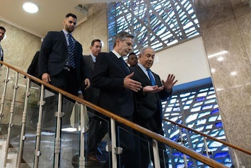 photo of Blinken and Netanyahu walking down steps