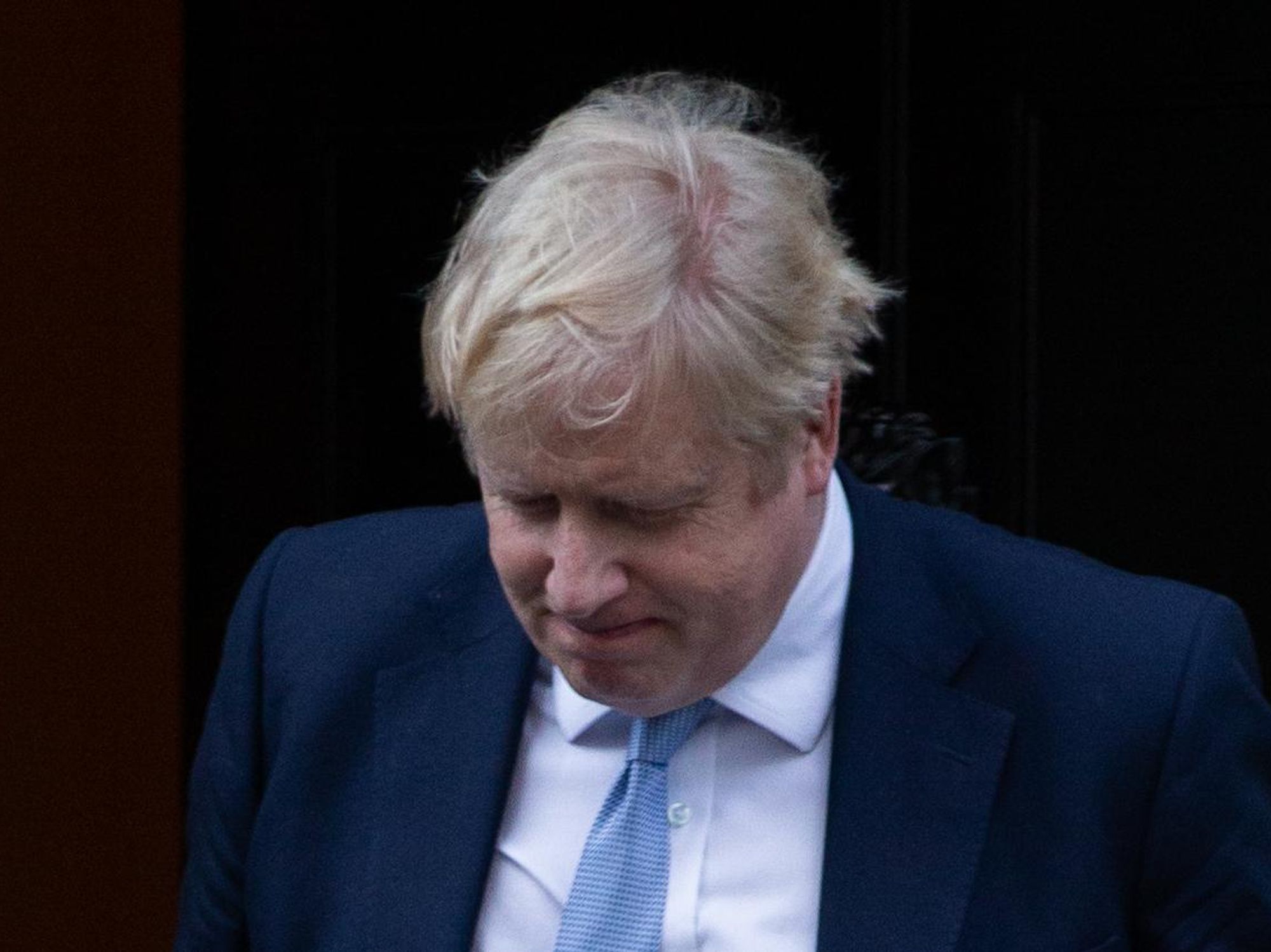 photo of boris johnson with his head down