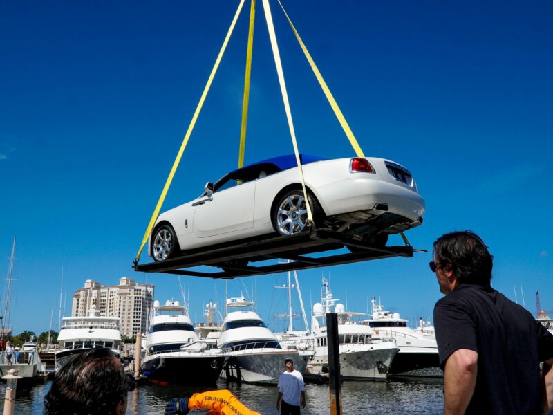Photo of cars and boats in the Palm Beach marina