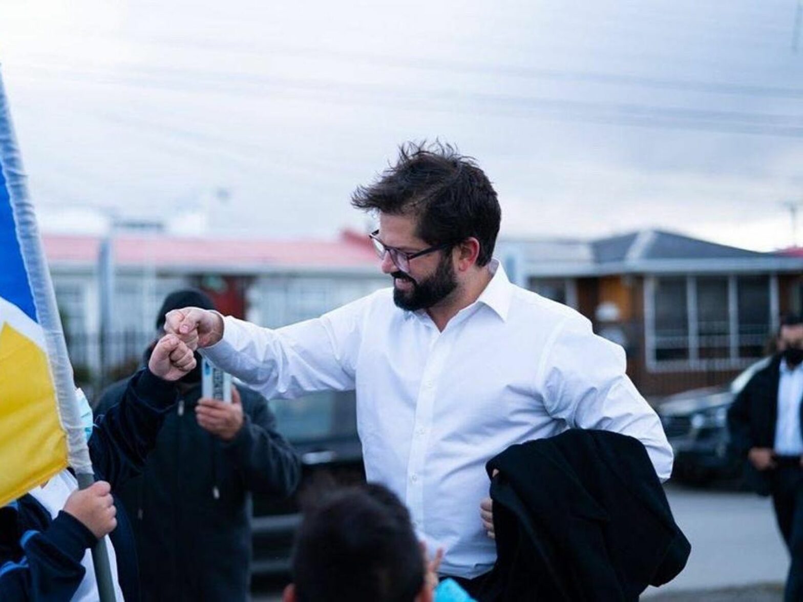 Photo of Chilean President Gabriel ​Boric fist bumping with a supporter in Magallanes, Chile, on May 5