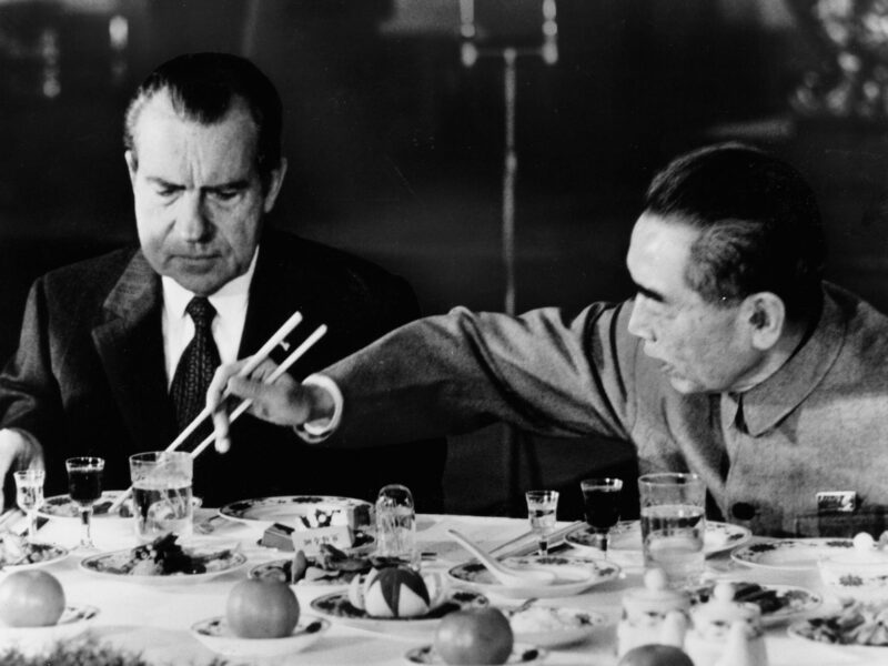 photo of china's premier eating from nixon's plate